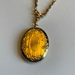 1928 Gold plated locket necklace. Gently used.